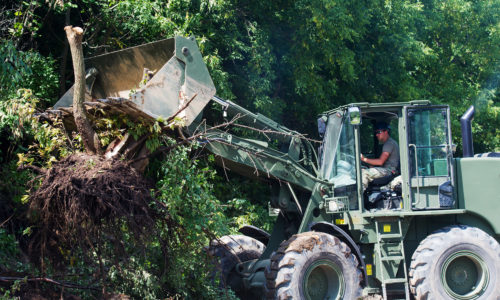 Engineers from the Wisconsin Army National Guard remove debris from roadways affected by flooding in the Town of Jefferson, Wis., Aug. 1. Twenty Soldiers from the Wisconsin National Guard's 229th Engineer Company and Company B, 173rd Brigade Engineer Battalion conducted debris removal missions in the Towns of Jefferson and Portland, Wis., Jul 28 to Aug. 1 after Heavy rain that soaked western Wisconsin last month caused flooding throughout the region. Wisconsin National Guard photo by Staff Sgt. Alex Baum